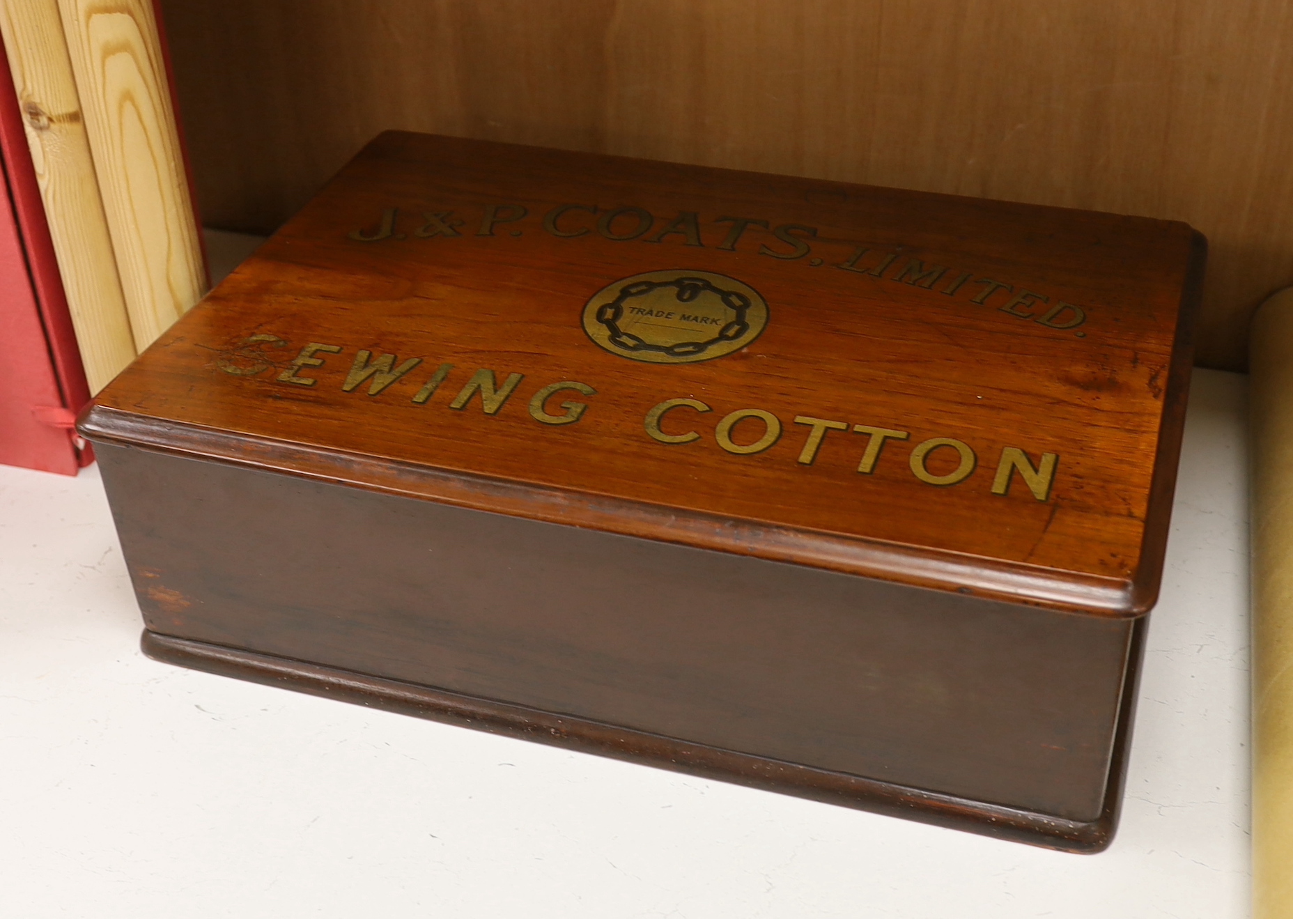 A retailer’s walnut counter box advertising 'J. & P. Coats Limited Sewing Cotton', two drawers with dividers, width 47cm, depth 32cm, height 15cm